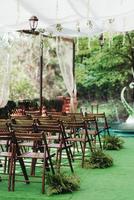 wedding ceremony in the woods among the trees on the green track photo