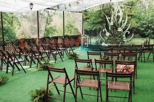 wedding ceremony in the woods among the trees on the green track photo