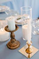 atmospheric candle decor with live fire on the banquet table photo