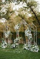 wedding ceremony area with dried flowers in a meadow photo