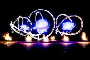 fiery pieces of a fire show photo