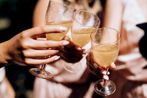 glasses in the frame, toast and people's hands photo