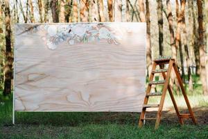 wedding ceremony in the woods among the trees on the green track photo