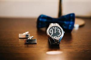 wedding ring in a box and watch the groom photo