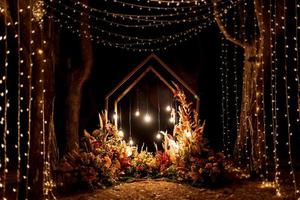 wedding ceremony area with dried flowers in a meadow photo