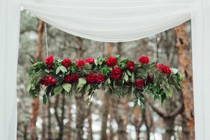 wedding ceremony in the woods among the trees on the green track photo