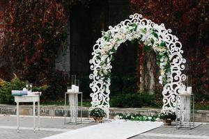 wedding ceremony in the woods among the trees on the green track photo