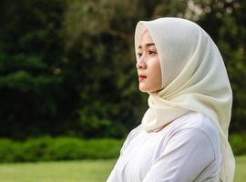 Muslim young women do yoga in the park photo