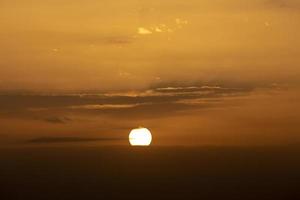 Colorful dramatic sky with cloud at sunset.Sky with sun background photo