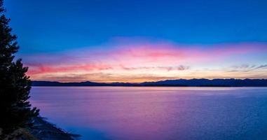 Sunrise over yellowstone lake in yellowstone national park photo