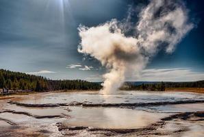 Eruption of Old Faithful geyser at Yellowstone Nationl park photo