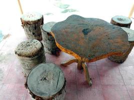 table and stool from tree on park photo