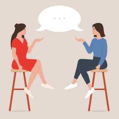 Two women are sitting and talking in cafe