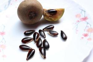 tasty and healthy sapodilla and seeds photo