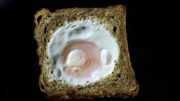 French Toast With An Egg Inside In A Pan photo