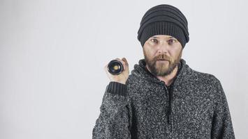 Man Holds A Diode Flashlight In His Hand photo