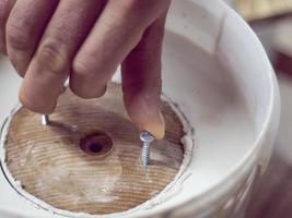 building plaster with wood pattern. gypsum hardens in a bucket photo