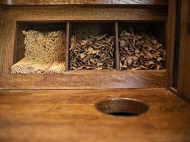 wooden disposable stirring sticks for coffee and sugar in sticks lie on a wooden shelf photo