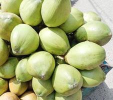 green colored raw coconut stock photo