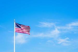 Amaerican flag on pole with blue sky photo