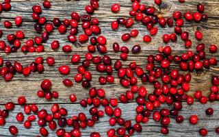 Cranberry on weathered wooden table table top view photo