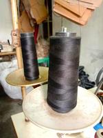 black colored yarn reel closeup photo