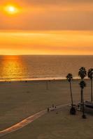 sunset at santa monica beach and pier photo