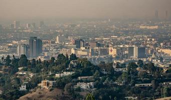 los angeles skyline and suburbs wrapped in smoke from woosle fires in 2018 photo