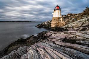 sunset in newport rhode island at castle hill lighthouse photo