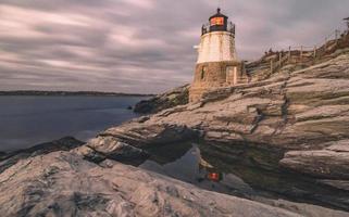 sunset in newport rhode island at castle hill lighthouse photo