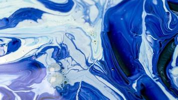 The colors of the aqueous ink are translucent. Abstract multicolored marble texture background photo