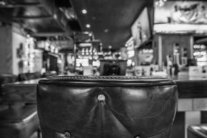 chairs and table with Blurred bar restaurant background photo