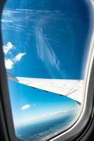Looking over aircraft wing in flight photo