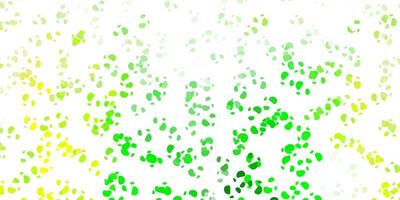 Light green, yellow vector pattern with abstract shapes.