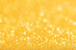 Festive Golden Glitter Abstract Background. Defocused sparkling backdrop photo