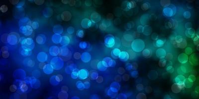 Dark Blue, Green vector background with bubbles.