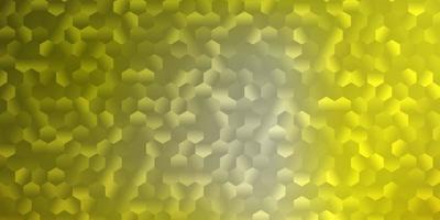 Light yellow vector backdrop with a batch of hexagons.