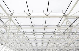 Glass roof with white beams photo