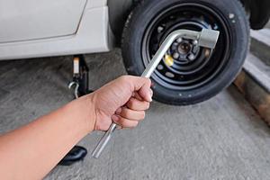 Car wheel changed by Wrench photo