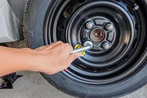 Car wheel changed by Wrench photo