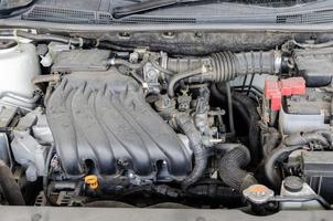 Car engine is engine dirty auto parts, dust accumulation. Dusty automobile components photo