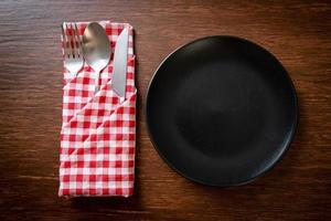 empty plate or dish with knife, fork and spoon photo