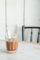 Hot chocolate glass on table photo