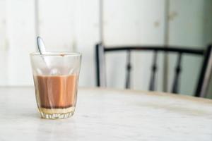Hot chocolate glass on table photo