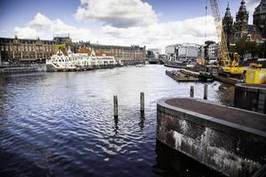 AMSTERDAM, NETHERLAND - SEPTEMBER 06, 2018, Central station building. The building of the Central station is one of the architectural attractions of the city, Netherland on September 06, 2018 photo