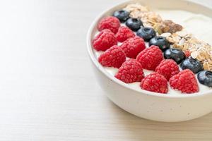 Homemade yogurt bowl with raspberry, blueberry and granola  - healthy food style photo