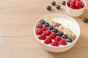 Homemade yogurt bowl with raspberry, blueberry and granola  - healthy food style photo