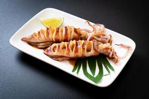 Grilled squid with teriyaki sauce on plate