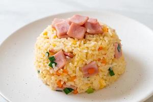 Homemnade fried rice with ham on plate photo