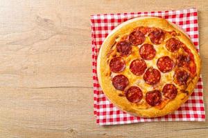 Pepperoni pizza on wood tray - Italian food style photo